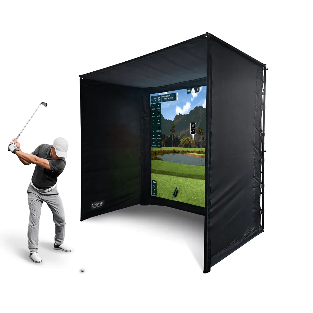 Golfer swinging into a SimSpace golf simulator enclosure with course displayed on impact screen